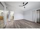 Bright and airy bedroom with wood-look floors and access to bathroom at 394 E Redfield Rd, Chandler, AZ 85225