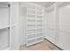 Large walk-in closet with ample shelving and hanging space at 394 E Redfield Rd, Chandler, AZ 85225