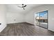 Large living room with sliding glass doors that lead to an outdoor balcony at 394 E Redfield Rd, Chandler, AZ 85225
