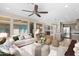 Open concept living room with kitchen and dining area views at 731 E Verde Blvd, Queen Creek, AZ 85140