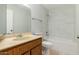 Clean bathroom with tiled walls, bathtub, and vanity at 8106 N 31St Dr, Phoenix, AZ 85051