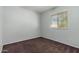 Simple bedroom with window and carpet flooring at 8106 N 31St Dr, Phoenix, AZ 85051