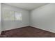 Bright bedroom with window, carpet, and double door closet at 8106 N 31St Dr, Phoenix, AZ 85051
