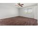 Bright bedroom with ceiling fan and carpet flooring at 8106 N 31St Dr, Phoenix, AZ 85051