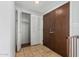 Clean entryway with tiled floors, double doors, and a closet at 8106 N 31St Dr, Phoenix, AZ 85051