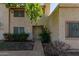 Tan two-story stucco condo building with a walkway and landscaping at 8106 N 31St Dr, Phoenix, AZ 85051