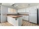 Bright kitchen features an island and updated appliances at 8106 N 31St Dr, Phoenix, AZ 85051