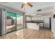 Kitchen with white cabinets, tiled floors, and sliding glass doors at 8106 N 31St Dr, Phoenix, AZ 85051