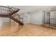 Living room with tiled floors and an open staircase at 8106 N 31St Dr, Phoenix, AZ 85051