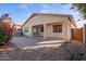 Home's backyard features a covered patio, and a brick paved patio at 10768 W Citrus Grove Way, Avondale, AZ 85392