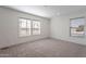 Bright bedroom with neutral walls, carpet flooring, and two large windows at 249 N 89Th St, Mesa, AZ 85207