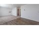 Spacious bedroom with hardwood and carpeted floors, and access to another room at 249 N 89Th St, Mesa, AZ 85207