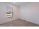 Well-lit bedroom featuring a window with blinds at 249 N 89Th St, Mesa, AZ 85207