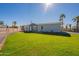 Newly built home with a well-maintained lawn and driveway at 249 N 89Th St, Mesa, AZ 85207