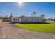 Single-story home with gray exterior, landscaping, and a grassy yard at 249 N 89Th St, Mesa, AZ 85207