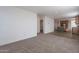Open living room with new carpet, and kitchen with island at 249 N 89Th St, Mesa, AZ 85207