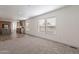 Bright living room with large windows and view of kitchen at 249 N 89Th St, Mesa, AZ 85207