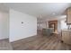 Open living room with new wood-look flooring and kitchen at 249 N 89Th St, Mesa, AZ 85207