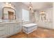 Luxurious bathroom with a soaking tub and dual vanities at 2912 E Vaughn Ave, Gilbert, AZ 85234