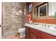 Elegant bathroom with marble shower and dark wood vanity at 2912 E Vaughn Ave, Gilbert, AZ 85234