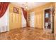 Spacious bedroom with tile floors and ensuite bathroom access at 2912 E Vaughn Ave, Gilbert, AZ 85234
