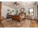 Spacious bedroom with a large wooden bed and tile floors at 2912 E Vaughn Ave, Gilbert, AZ 85234