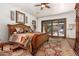 Bright bedroom with a king-size bed and access to a patio at 2912 E Vaughn Ave, Gilbert, AZ 85234