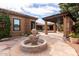 Charming courtyard with stone fountain and pergola at 2912 E Vaughn Ave, Gilbert, AZ 85234