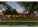 Beautiful home exterior at dusk, showcasing the home's architectural details at 2912 E Vaughn Ave, Gilbert, AZ 85234