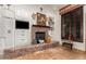 Cozy Gathering room with a stone fireplace and built-in shelving at 2912 E Vaughn Ave, Gilbert, AZ 85234