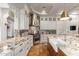 Modern kitchen with granite countertops and a farmhouse sink at 2912 E Vaughn Ave, Gilbert, AZ 85234