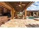 Outdoor kitchen with built-in grill and seating area at 2912 E Vaughn Ave, Gilbert, AZ 85234