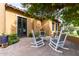 Relaxing patio with rocking chairs, perfect for outdoor enjoyment at 2912 E Vaughn Ave, Gilbert, AZ 85234