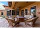Relaxing patio with wicker furniture and fire pit, perfect for outdoor entertaining at 2912 E Vaughn Ave, Gilbert, AZ 85234