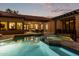 Luxury pool with a view of the home and beautiful sunset at 2912 E Vaughn Ave, Gilbert, AZ 85234