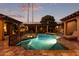 Stunning pool and spa with expansive patio and outdoor kitchen at 2912 E Vaughn Ave, Gilbert, AZ 85234