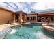 Stunning pool with cascading waterfall and relaxing lounge area at 2912 E Vaughn Ave, Gilbert, AZ 85234