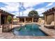 Inviting pool with waterfall feature and spacious deck at 2912 E Vaughn Ave, Gilbert, AZ 85234
