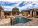 Expansive pool with surrounding patio and seating area at 2912 E Vaughn Ave, Gilbert, AZ 85234