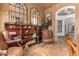 Charming sitting room with antique furniture and tile floors at 2912 E Vaughn Ave, Gilbert, AZ 85234