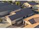 Aerial view showcasing a single-story home's backyard and garage at 664 W Jardin Dr, Casa Grande, AZ 85122