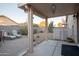 Relaxing backyard patio with seating and desert landscaping at 664 W Jardin Dr, Casa Grande, AZ 85122