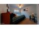 Well-lit bedroom with a comfortable bed and nautical-themed decor at 664 W Jardin Dr, Casa Grande, AZ 85122