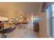 Bright living room featuring tiled floors, ceiling fan, and access to backyard at 664 W Jardin Dr, Casa Grande, AZ 85122