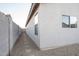 Side yard with gravel pathway and block wall at 664 W Jardin Dr, Casa Grande, AZ 85122