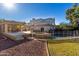 Lush backyard with a pool, spa, and covered patio at 9382 E Aster Dr, Scottsdale, AZ 85260