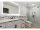 Modern bathroom with granite countertop and glass shower at 9382 E Aster Dr, Scottsdale, AZ 85260