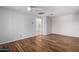 Spacious bedroom with wood floors and access to bathroom at 9382 E Aster Dr, Scottsdale, AZ 85260