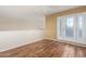Bright bedroom featuring wood floors and access to a private balcony at 9382 E Aster Dr, Scottsdale, AZ 85260