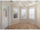 Bright breakfast nook with a chandelier and backyard access at 9382 E Aster Dr, Scottsdale, AZ 85260
